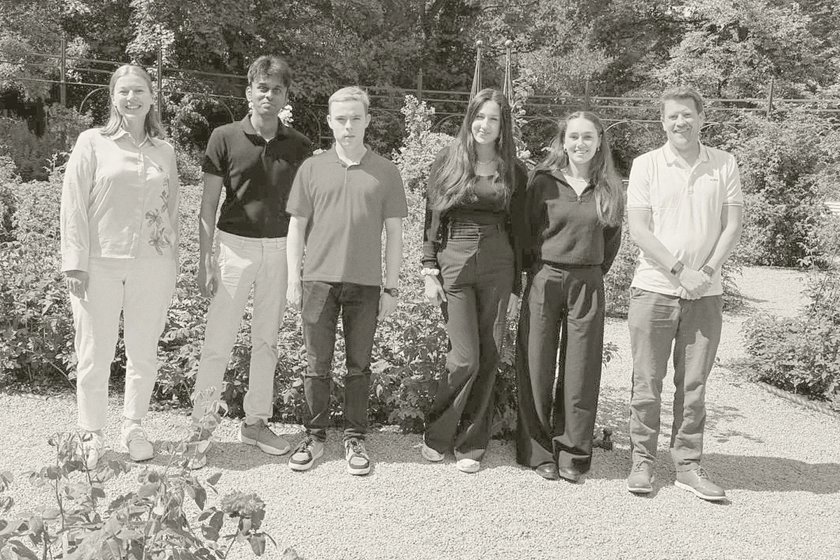 Narrative’s summer 2026 interns with members of the team in a garden.